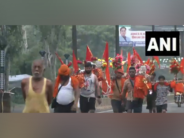 Kanwariyas arrive in large numbers in Moradabad with holy water from Haridwar ahead of last Sawan Monday (Photo/ANI)
