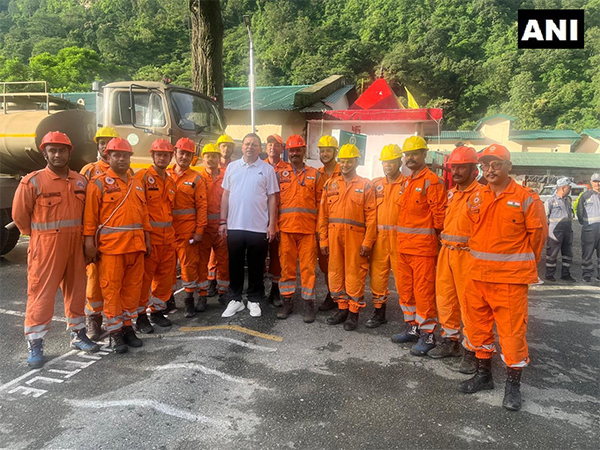 CM Dhami interacts with rescue team members before their departure to disaster-hit Uttarkashi.(Photo/ Press Release)