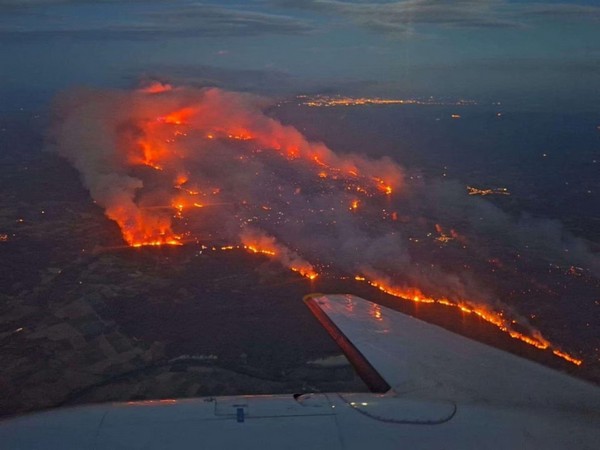 An aerial view shows wildfire spreading near Saint-Laurent-de-la-Cabrerisse village in southern France (Photo/Reuters)