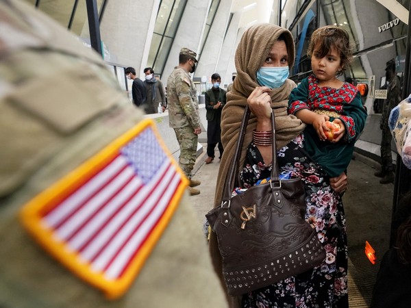 Afghan refugees board a bus to a processing center upon arrival at Dulles International Airport in Virginia, a day after US forces completed their troop withdrawal from Afghanistan, on September 1, 2021 (File Photo/Reuters) Afghan refugees board a bus to a processing center upon arrival at Dulles International Airport in Virginia, a day after US forces completed their troop withdrawal from Afghanistan, on September 1, 2021 (File Photo/Reuters)