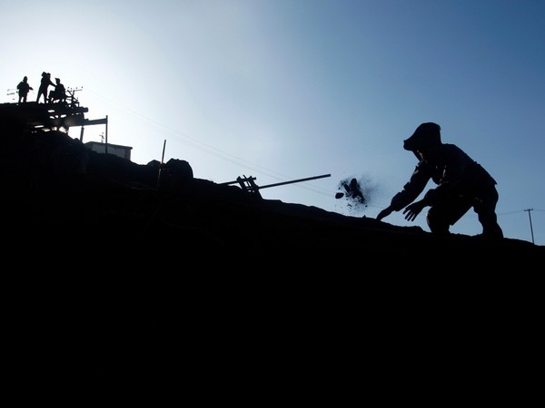 An Afghan miner sifts through coal at the Karkar coal mine in Pul-i-Kumri, approximately 170 km north of Kabul (File Photo/Reuters) An Afghan miner sifts through coal at the Karkar coal mine in Pul-i-Kumri, approximately 170 km north of Kabul (File Photo/Reuters)