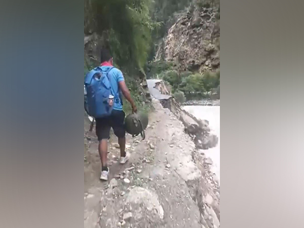 Uttarakhand Police flood unit personnel conducts search and rescue on foot in disaster-hit areas of Dehradun (Photo/ANI)