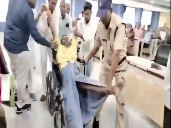 Differently-abled person dragged during Prajavani event. (Photo: Kavitha/X)