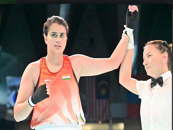 Ritika with her hand raised in victory. (Photo:  Boxing Federation of India/Olympics.com)