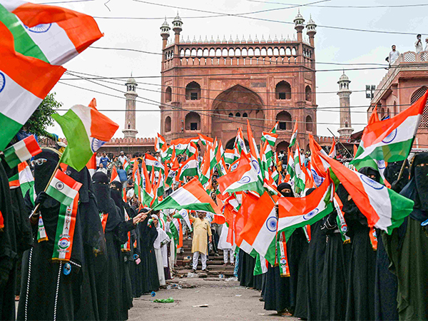Women wave the Tricolour outside the historic Jama Masjid in Delhi (Photo/ANI)