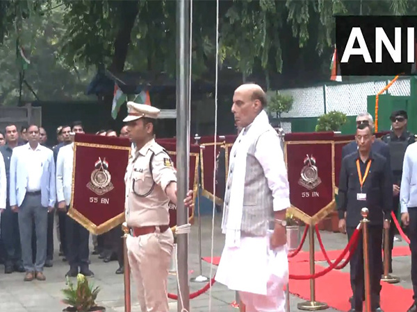 Defence Minister Rajnath Singh hoists flag at his residence (Photo/ANI)