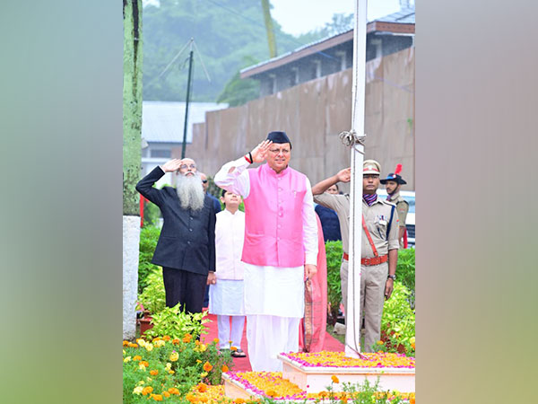 Chief Minister Pushkar Singh Dhami hoisted the National Flag at his residence in Dehradun on the occasion of the 79th Independence Day (Photo/ANI)