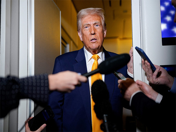 US President Donald Trump speaks to the media on board Air Force One (File Photo/ Reuters)
