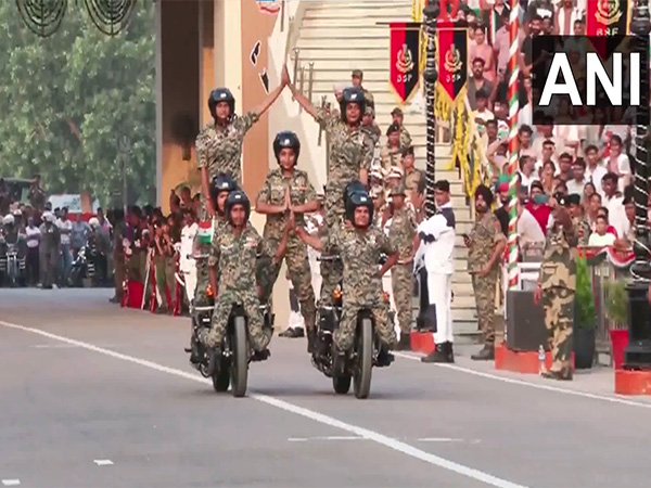 BSF jawans perform bike stunts at Attari border in Punjab. (Photo/ANI)