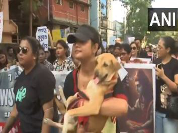 Animal lovers in West Bengal's Siliguri stage a protest (Photo/ANI)