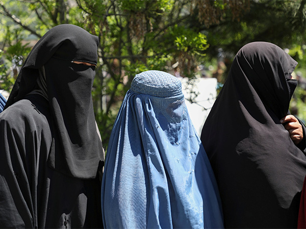 Afghan women wait to receive free wheat distributed by the government during a quarantine amid concerns over the COVID-19 pandemic (File Photo/Reuters) Afghan women wait to receive free wheat distributed by the government during a quarantine amid concerns over the COVID-19 pandemic (File Photo/Reuters)