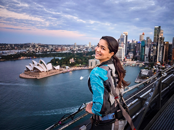 Sara Tendulkar, Tourism Australia's Come and say G'day Campaign Ambassador, takes in the views of the Sydney Opera House and city skyline from atop the Sydney Harbour Bridge.