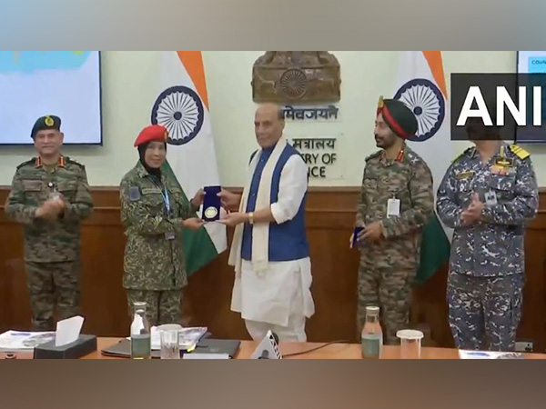 Defence Minister Rajnath Singh with UN women officers (Photo/ ANI)