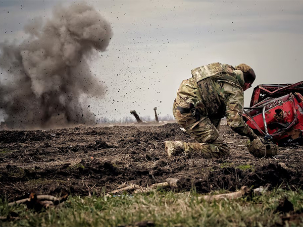 Ukrainian serviceman reacts as he throws a grenade during a training, amid Russia's invasion of Ukraine, in Donbas region, Ukraine (Image/Reuters)