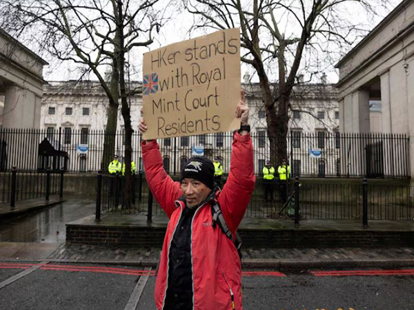 A protestor holds a placard during a demonstration against the proposed site of the new Chinese Embassy, outside Royal Mint Court, in London (Image/Reuters)
