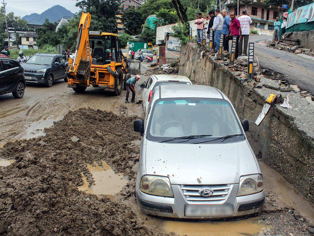 JCB clears the debris for vehicles stuck in the silt. (File photo/ANI)