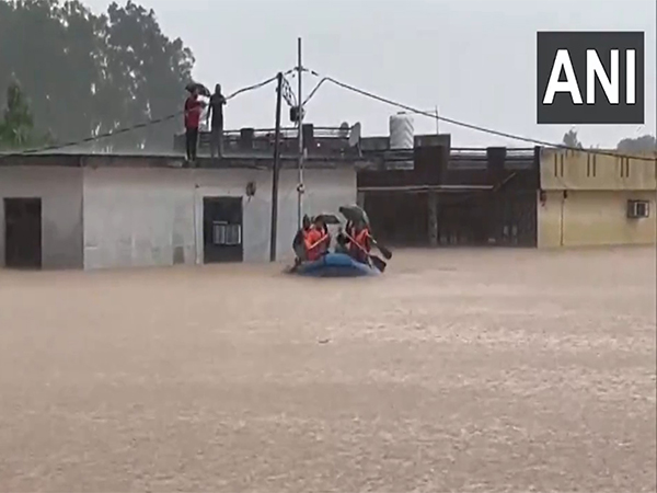 Visuals from Gadigarh area of Jammu shows Indian Army is continuously rescuing people stranded on boats. (Photo/ANI)