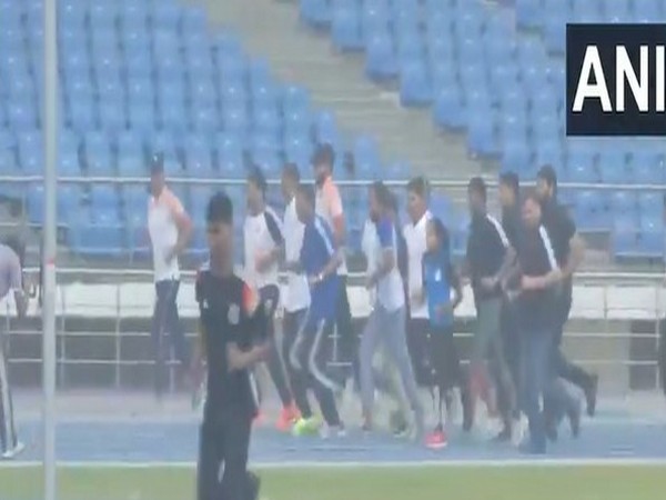 Union Sports Minister Mansukh Mandaviya running with Indian athletes at the track (Photo: ANI)