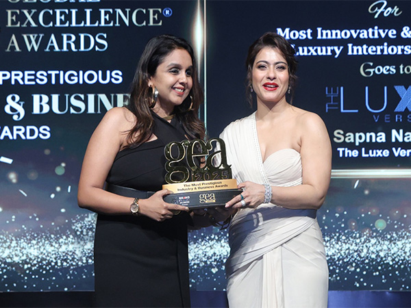 On stage at the Global Excellence Awards 2025, Mrs. Sapna Navin, Founder & CEO of THE LUXE VERSION, celebrates her big win, honoured by Mrs. Kajol Devgan