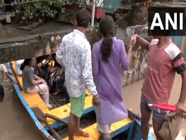 People of Yamuna Bazar move to safer locations due to heavy rain (Photo/ANI)