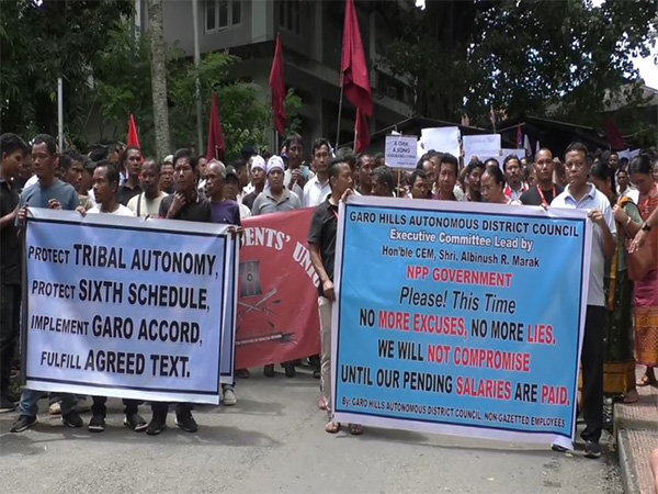 GHADC employees hold a mega protest rally for release of their pending salaries in Tura (Photo/ANI)