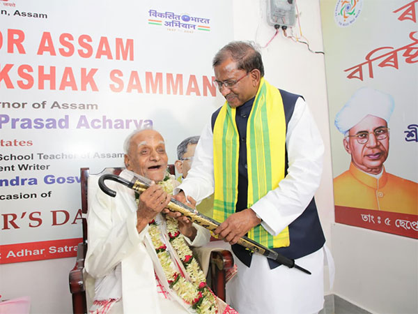 Assam Governor Lakshman Prasad Acharya felicitated Rajat Chandra Goswami, a 94-year-old primary school teacher. (Photo/ANI)