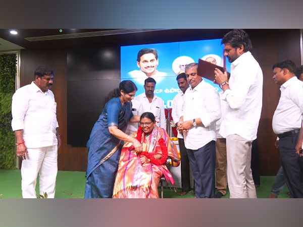 A teacher being felicitated by YSRCP leaders. (Photo/ANI) 