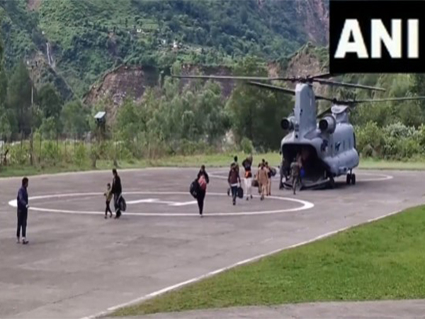 Pilgrims coming down from Air Force's Chinook helicopter in Himachal's Chamba (Photo/ANI)