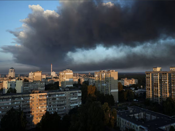 Thick smoke from a nearby strike site fills the sky during a Russian drone strike in Ukraine (Image/Reuters)