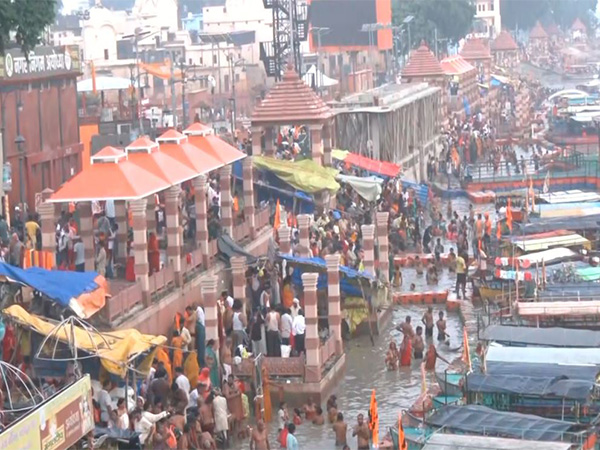 Devotees take a holy dip in River Saryu in Ayodhya after total lunar eclipse (Photo/ANI)