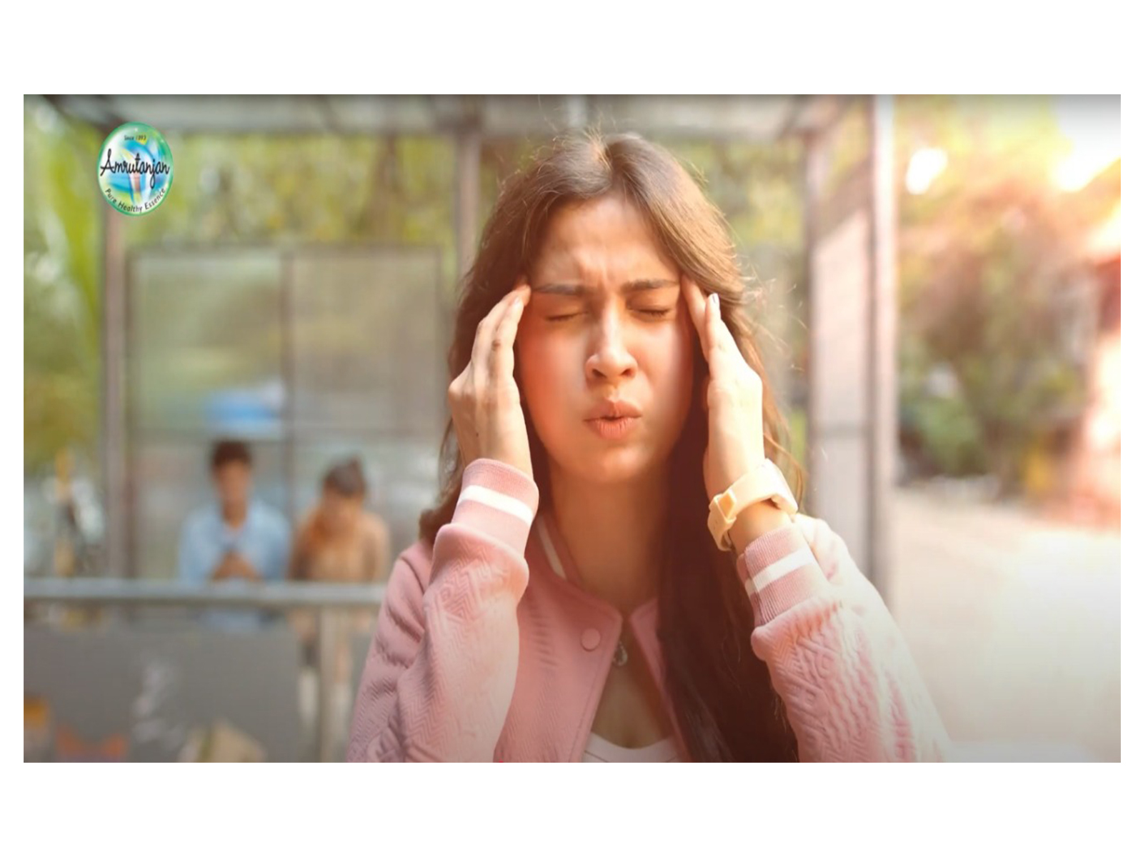 A still from the Amrutanjan TVC campaign, capturing a moment where a woman is seen experiencing pain, highlighting the everyday struggles that the brand aims to ease