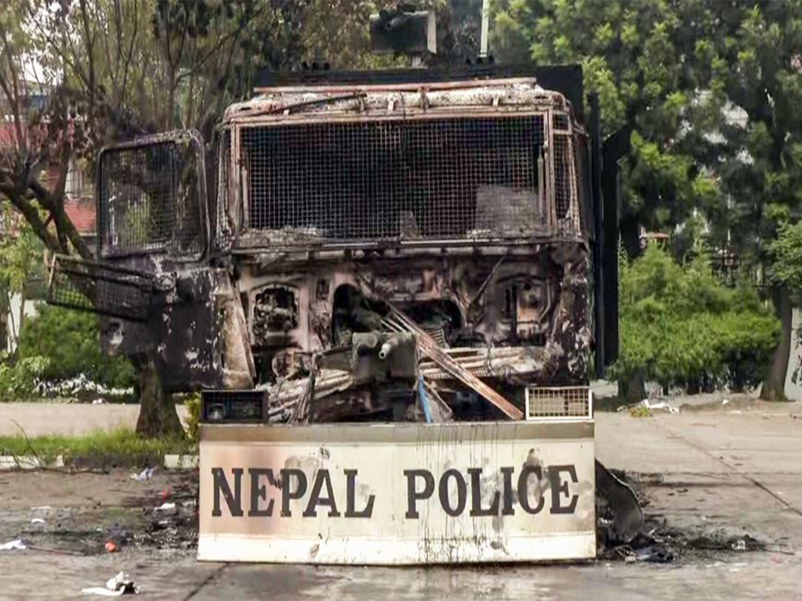 Charred remains of a Nepal Police vehicle following the violent protest against the Government over alleged corruption (File Photo/ANI)