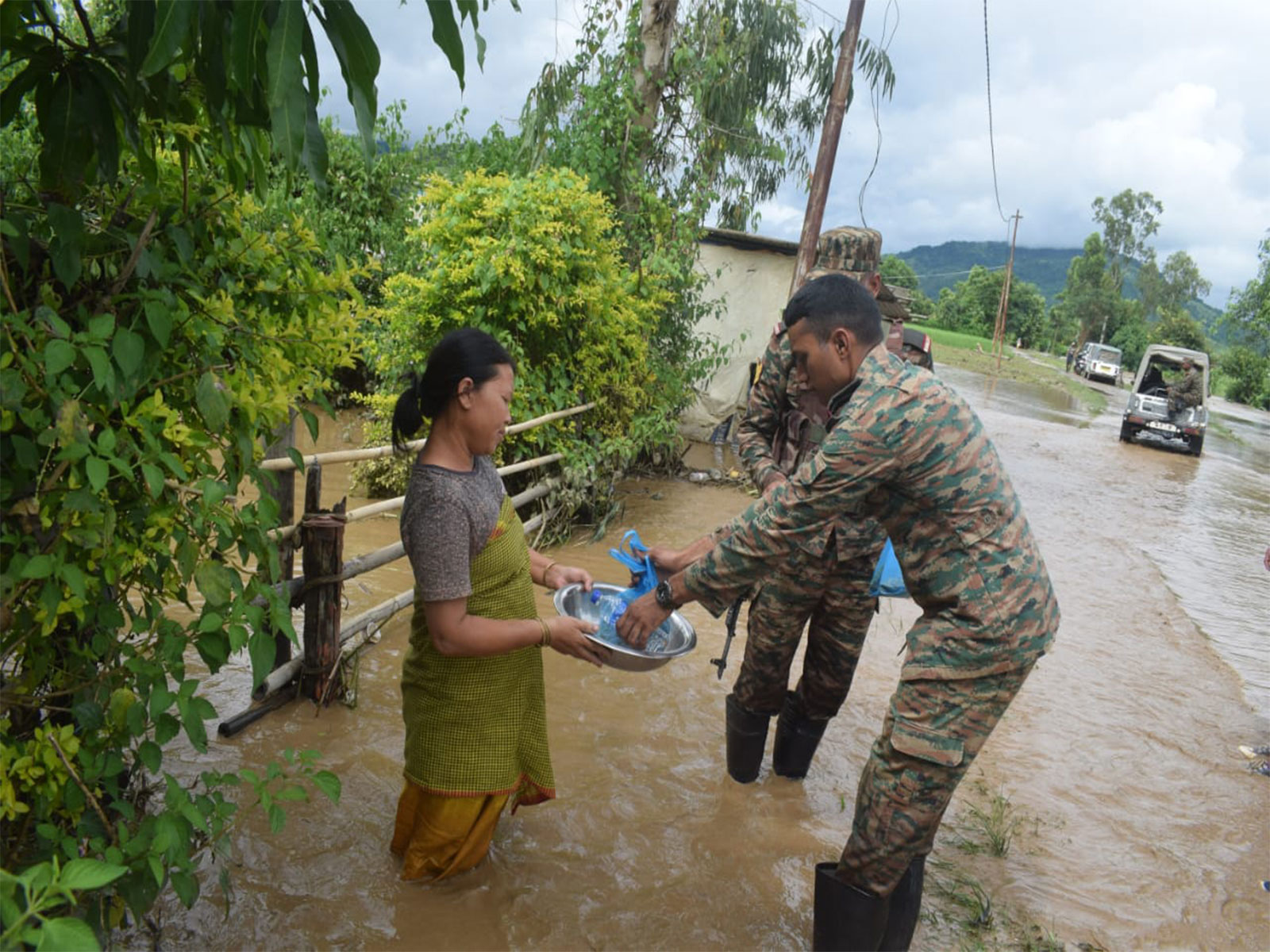 Army personnel helping locals by distributing essentials (Photo/ Indian Army)