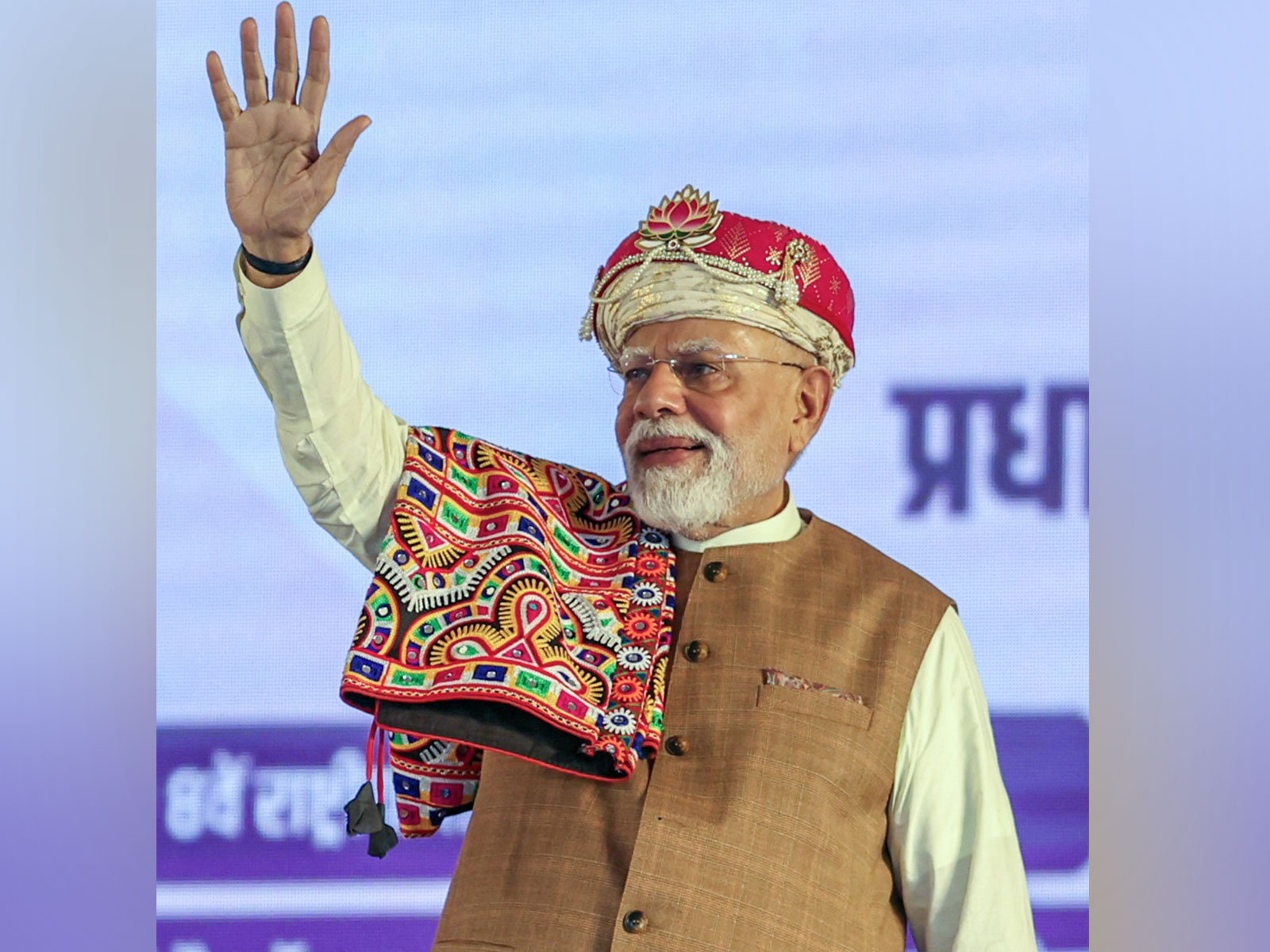 Prime Minister Narendra Modi waves at the crowd during public meeting in Dhar on Wednesday (Photo: ANI)