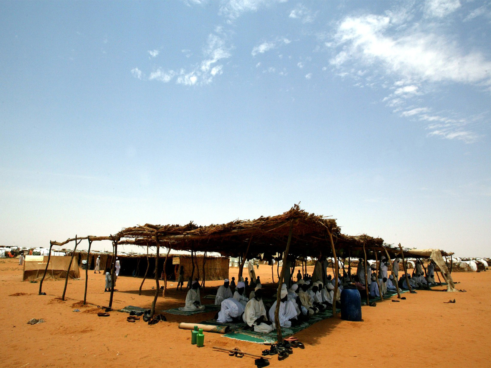 Displaced Sudanese men during Friday prayers in a makeshift mosque in Abu Shouk camp in northern Darfur region of Sudan (Photo/Reuters)