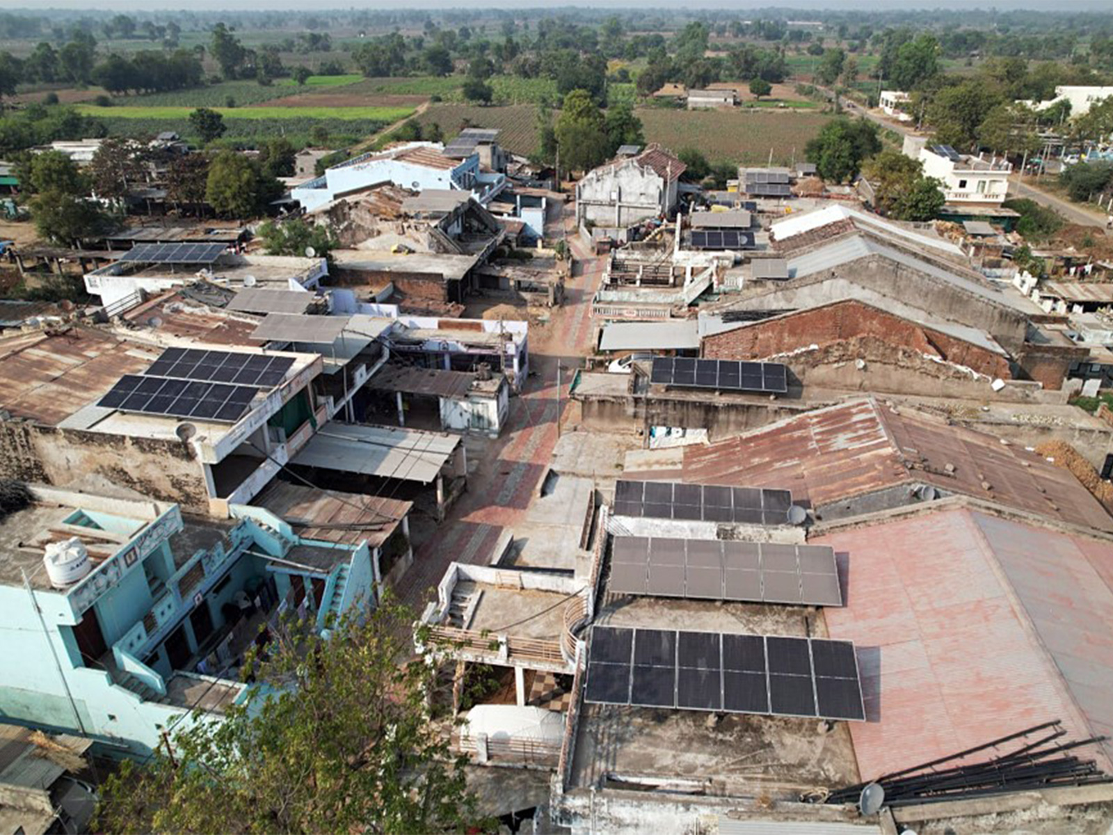 An aerial view of solar panels installed at rooftop of residential houses. (File Photo/ANI)