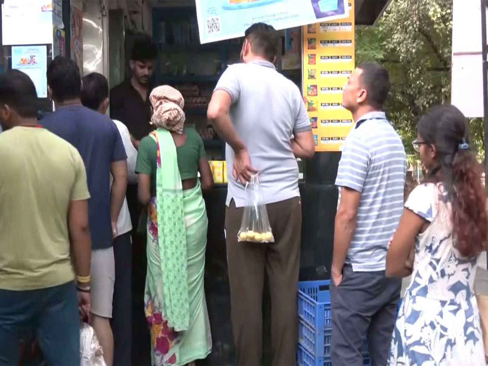 Consumers outside a Milk booth in Delhi (Photo/ANI)
