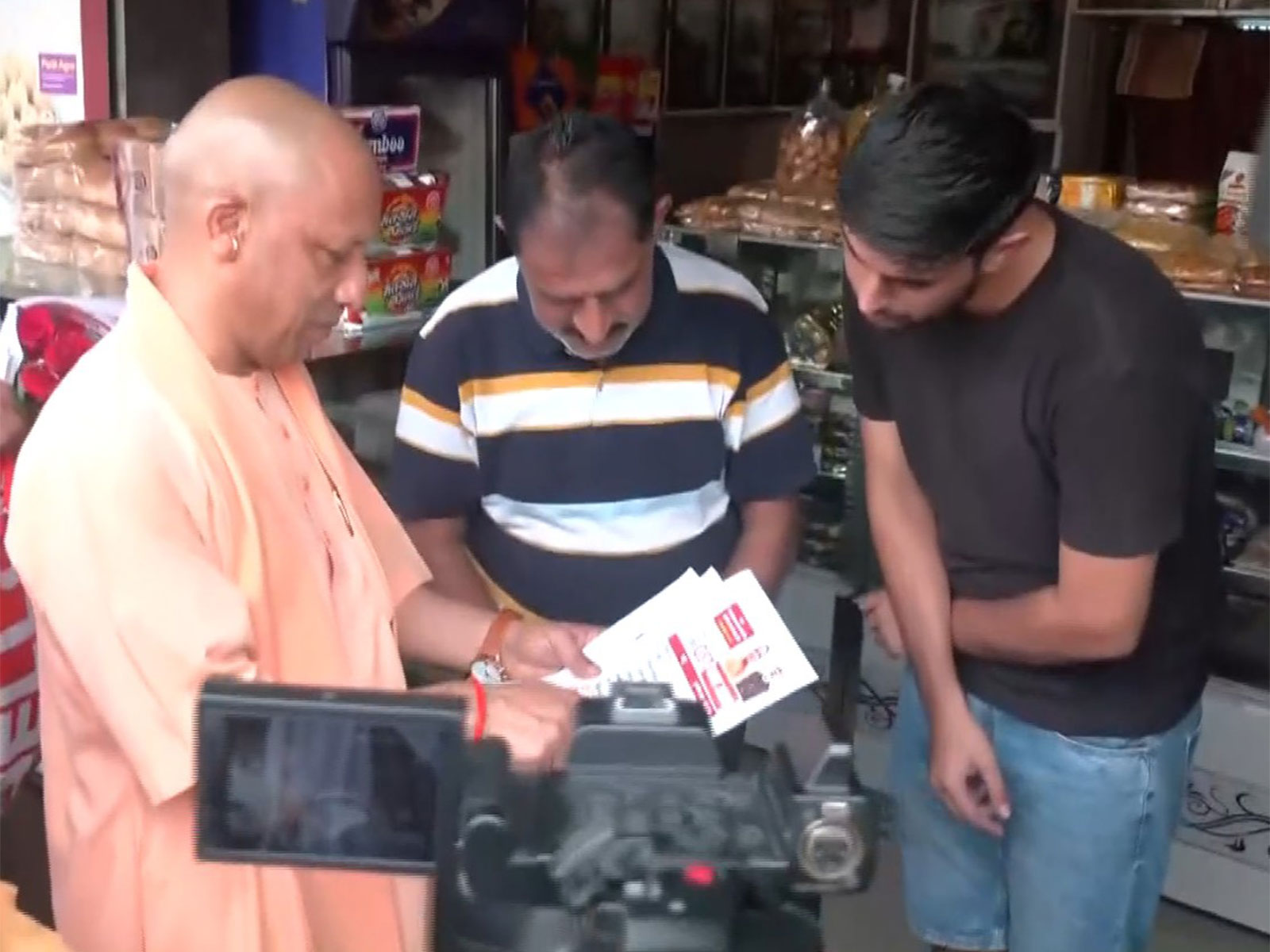 UP CM Yogi Adityanath interacts with traders in UP (Photo/ANI)