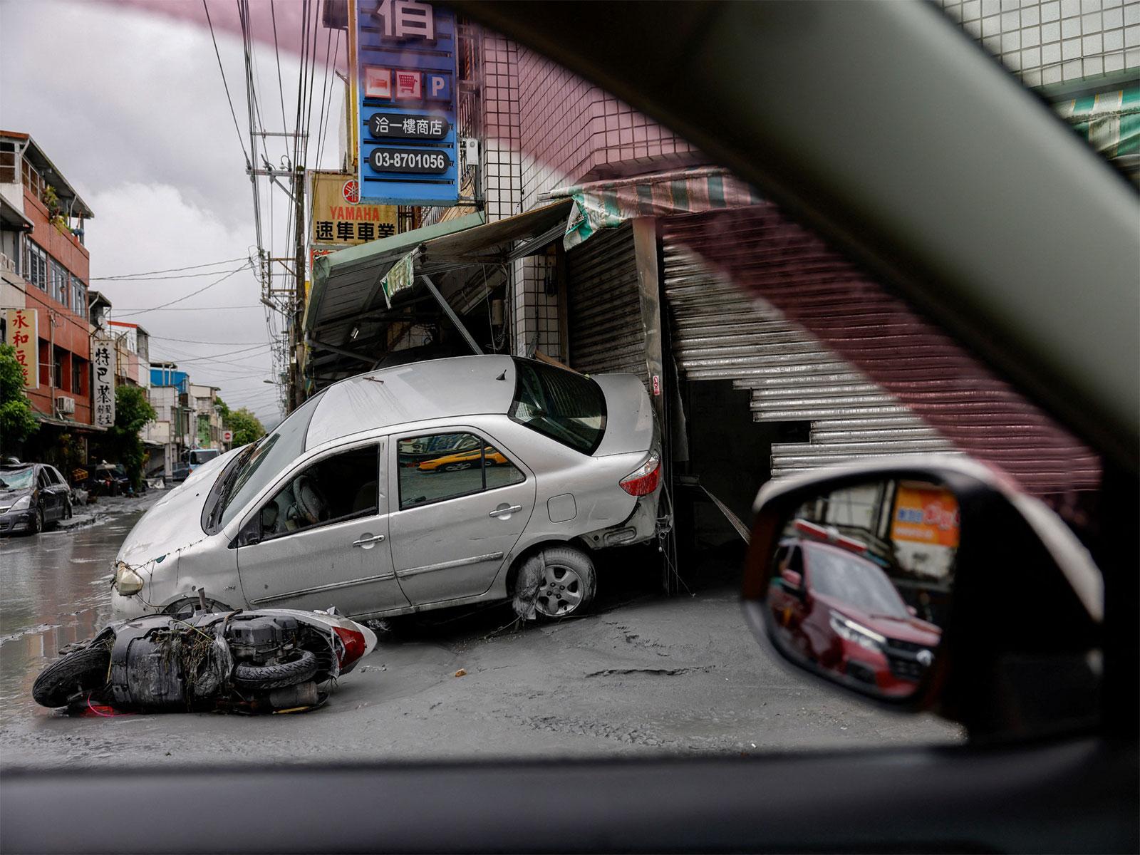 Damaged cars lie in the aftermath of flooding brought by Super Typhoon Ragasa in Hualien, Taiwan, on Sept 24, 2025. (Photo/Reuters)