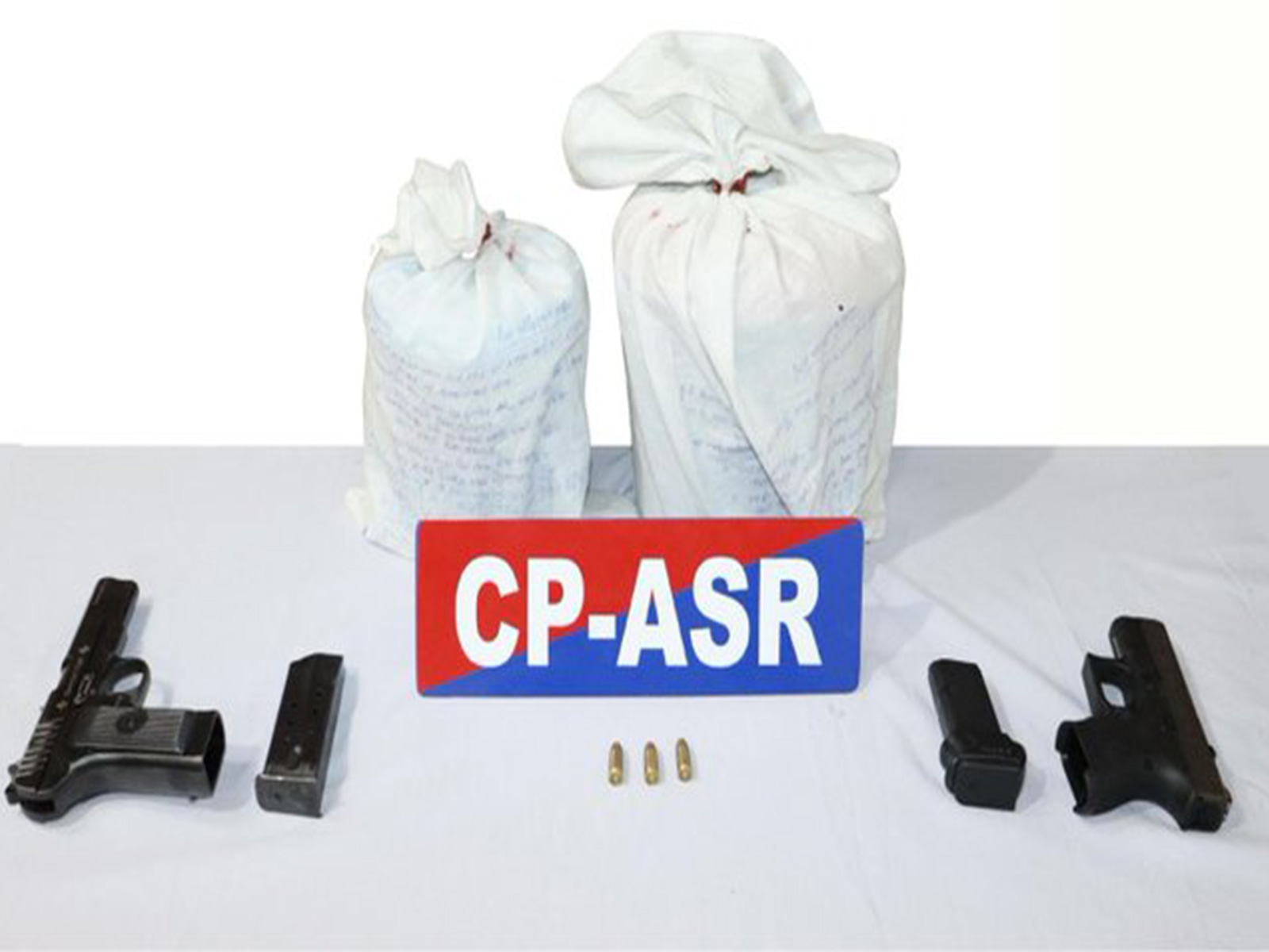 Amritsar Police recovers 4.03 kg heroin and two pistols (Photo/X@DGPPunjabPolice)