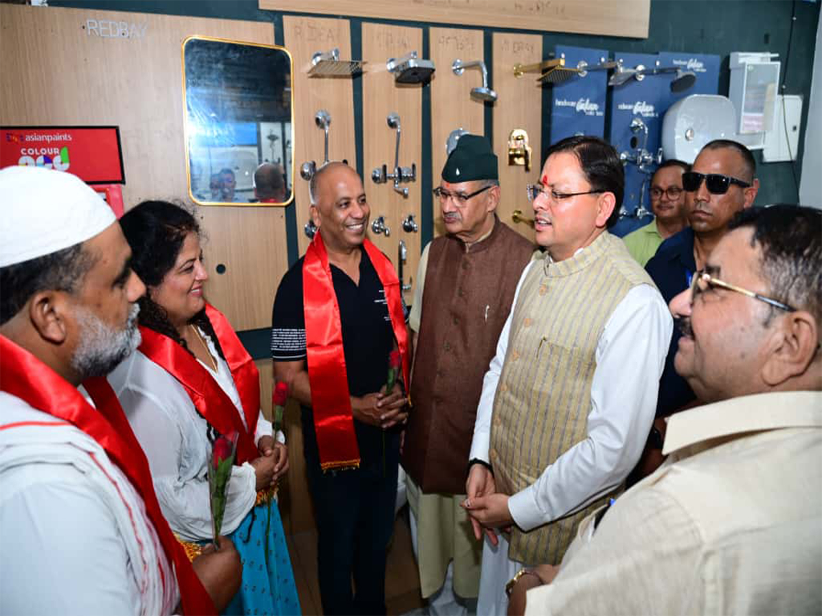 CM Dhami interacting with shopkeepers in Dehradun. (Photo/ANI)