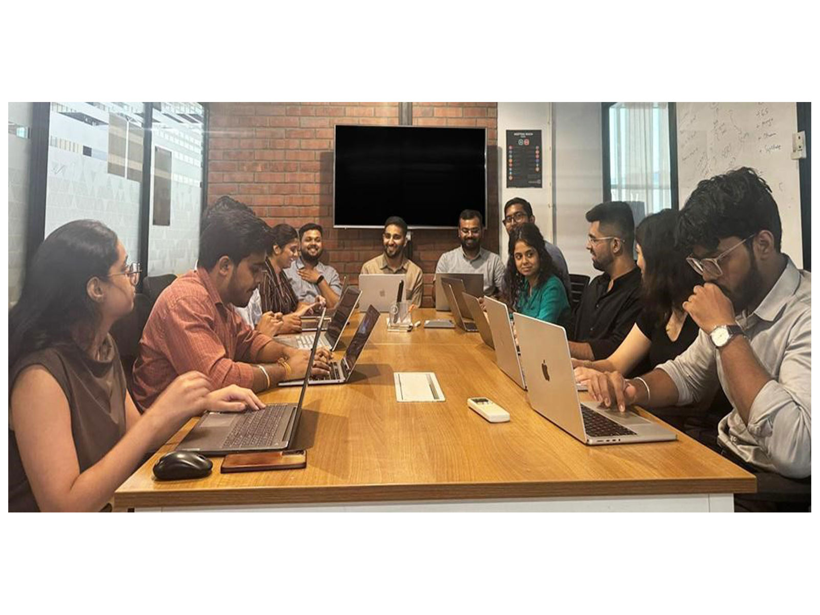 CloudHire team in conversation with CEO Sufiyan Ishaq, enjoying a light moment during the meeting