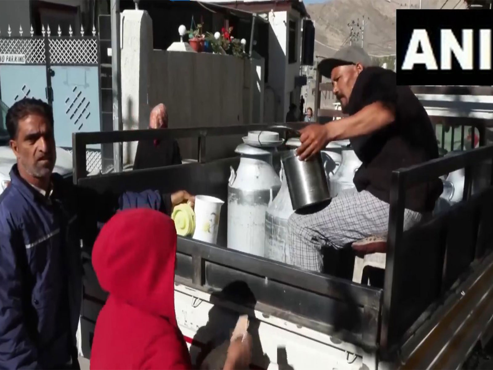 People buying milk amid restrcitions in Leh (Photo/ANI)