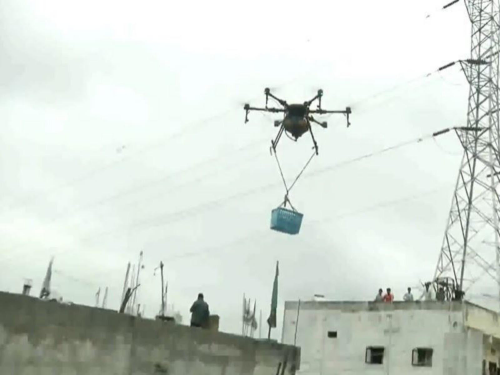 Rescue teams delivering food and other supplies in flood-hit areas. (Photo/ANI)