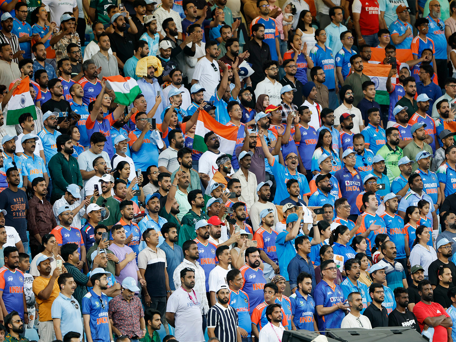 Spectators stand during the national anthem at Dubai International Cricket Stadium (Photo: ANI)