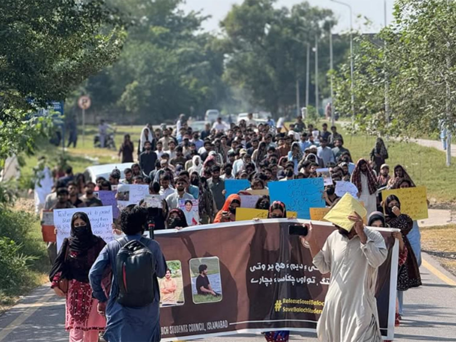 Baloch students march with banners and placards at Quaid-i-Azam University in Islamabad during a protest demanding the recovery of missing students and an end to racial profiling. (Image: X/@TBPEnglish)