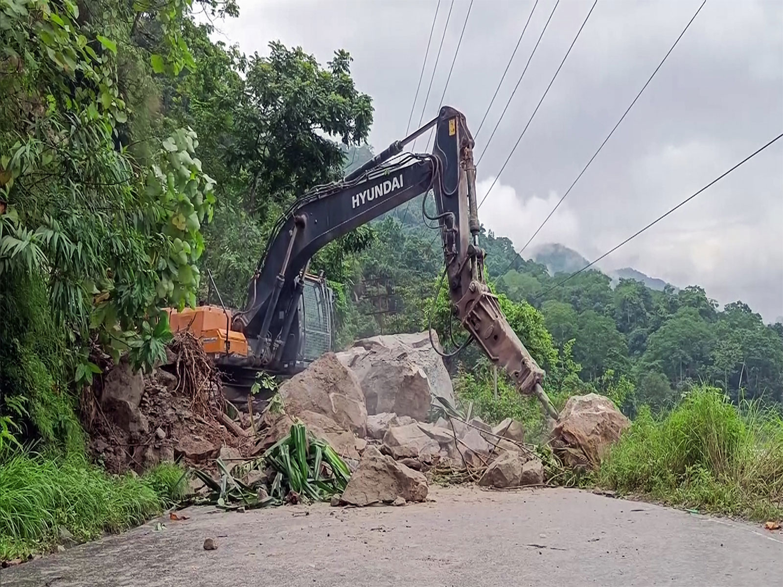 Road clearance work underway after landslide triggered by incessant rainfall at Kalijhora along NH10 in Kalimpong (File Photo/ANI)