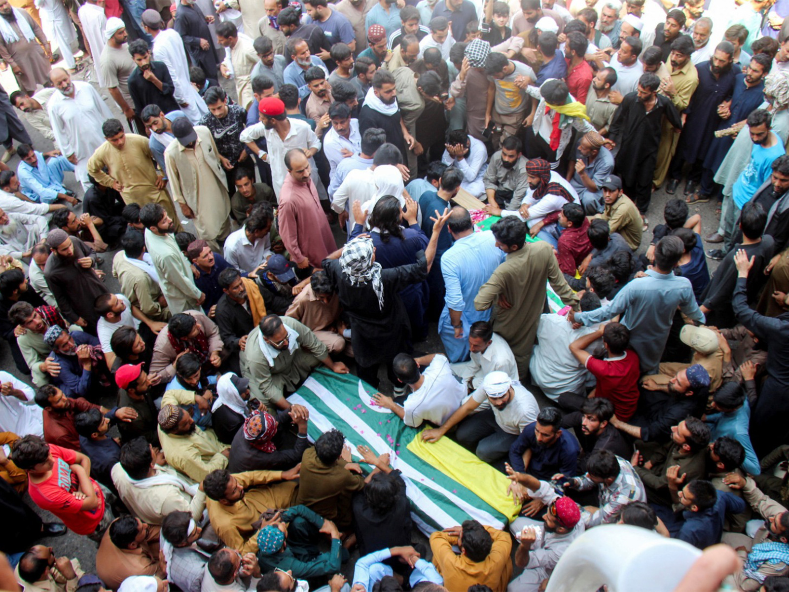 People attend the funeral of men, killed during PoJK protests (Photo/Reuters)