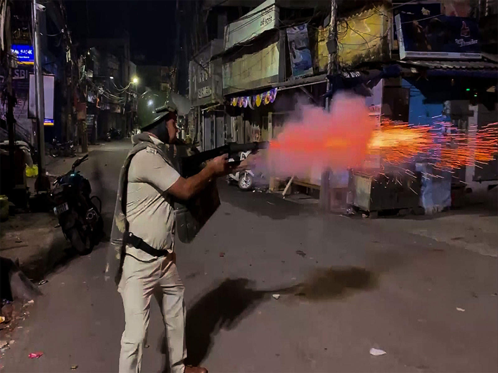 Police use tear gas to disperse people after a clash between two groups in Cuttack (Photo/ANI)