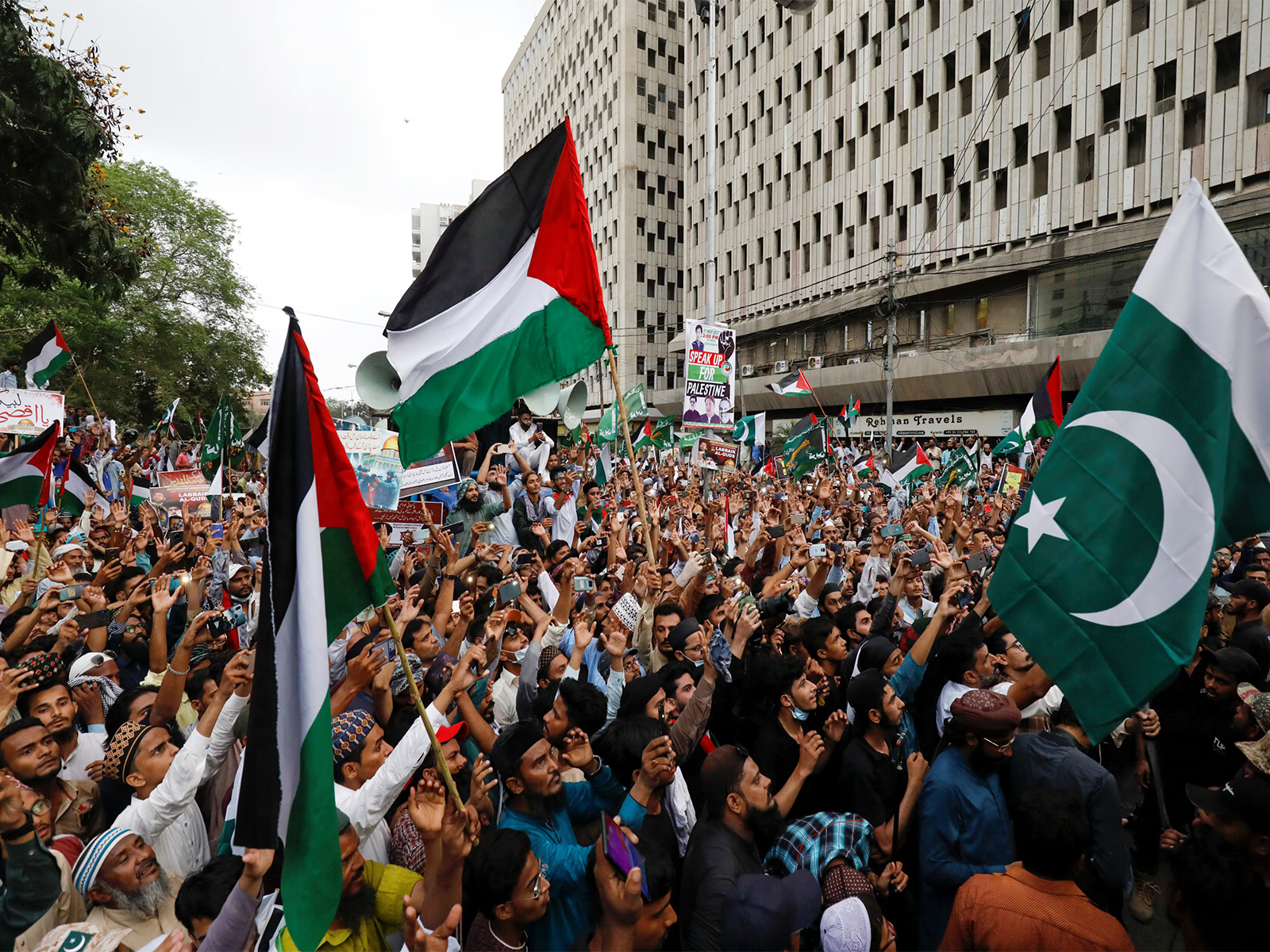 People carry flags and chant slogans during a rally in Karachi to express solidarity with Palestinians and protest against Israel’s actions in Gaza (File Photo/Reuters)